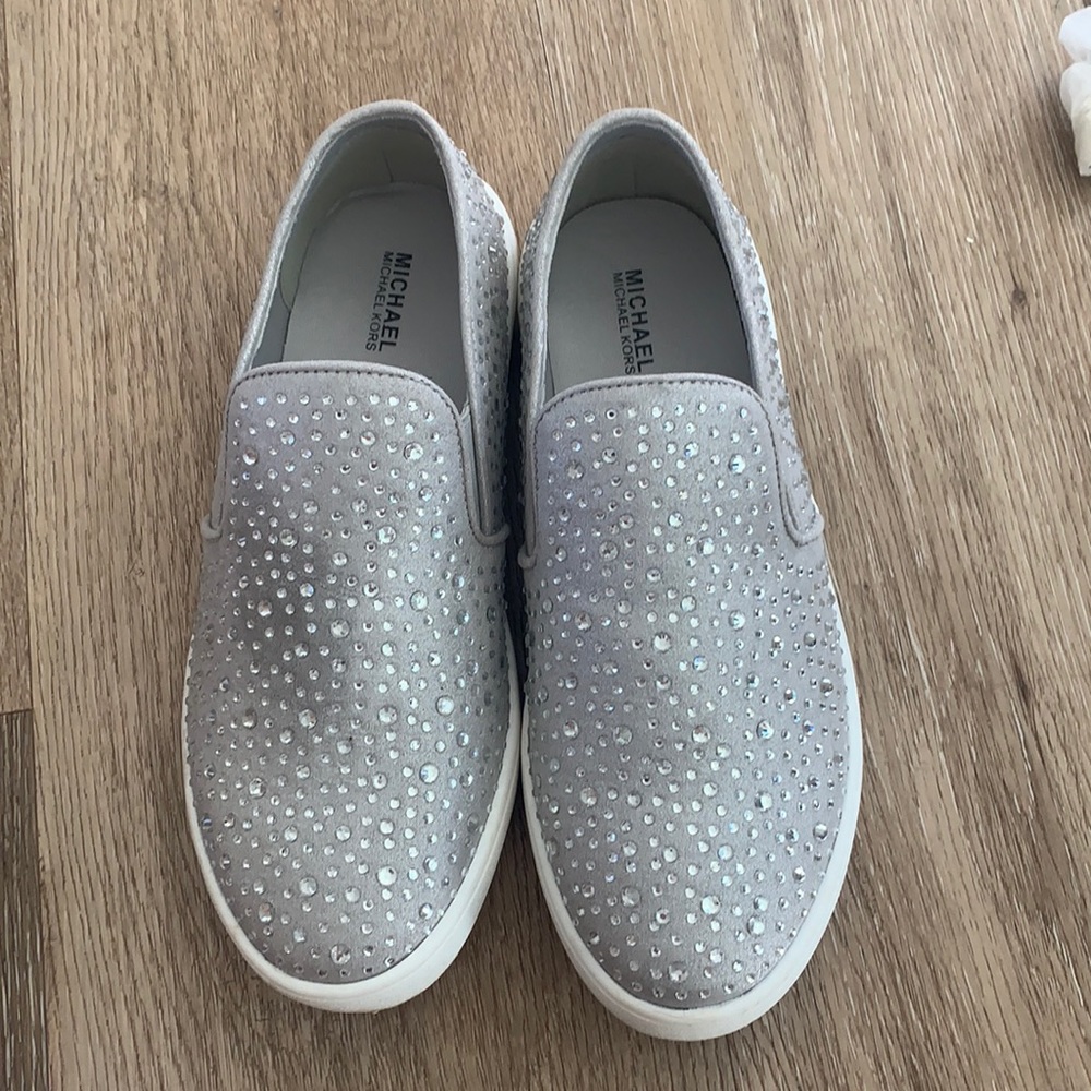 BRAND NEW Michael Kors Silver Sparkle grey slip on sneakers size 4.